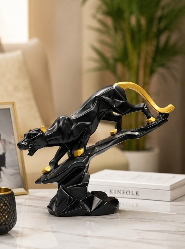 Modern black and gold angry leopard decorative sculpture made from fiber resin for luxury home and office decor.