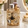Luxury Crystal Golden Brush Holder for organizing makeup brushes on a vanity table.