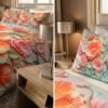 3D embossed floral bedsheet set with coral and pink poppies on king size bed in luxury Dubai bedroom realfound.store